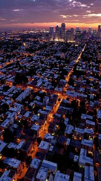 Wide-Angle Shot: A sprawling urban landscape featuring diverse neighborhoods transitioning from residential to commercial areas at sunset. Soft gradients create harmony between different city aspects.