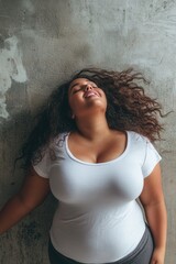 Fototapeta premium Woman Leaning Against Wall