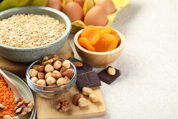 Different products rich in iron on light table, space for text. Anemia diet plan