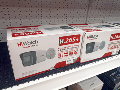 Surveillance cameras on retail shelf with h.265+ technology in white packaging