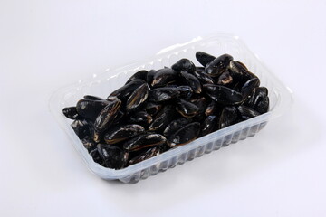 fresh mussel isolated on white background. Fresh mussels in a plastic box