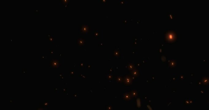 fire sparks from campfire with ash rise over black background, danger explosion