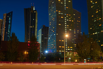 Fototapeta premium Evening view of the city of Astana. Astana is the capital of Kazakhstan. Center of the Astana city, the capital of Kazakhstan. Motion blur effect of cars. 