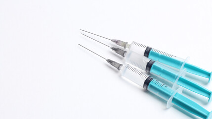 Medical syringe on a white background. A syringe for injection. The concept of health and beauty