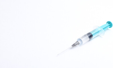Fototapeta premium Medical syringe on a white background. A syringe for injection. The concept of health and beauty