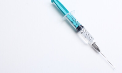 Medical syringe on a white background. A syringe for injection. The concept of health and beauty