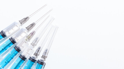 Disposable plastic syringe prepared for injection and vaccination in the hospital. The concept of...