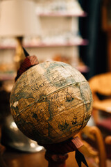 vintage old globe on wooden stand