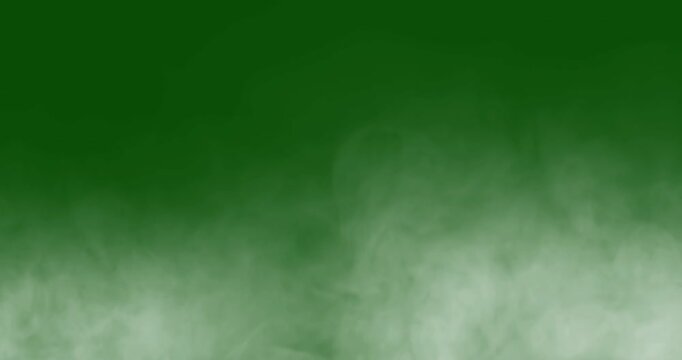 smoke slowly floating through space against chroma key green screen