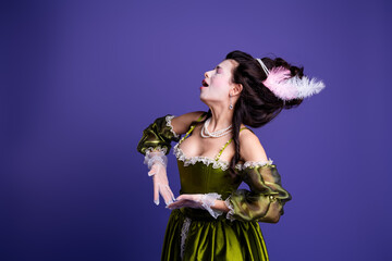 Elegant woman in baroque green dress on purple background, portraying a historical noble theme