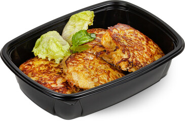 Fried potato pancakes in a black plastic lunchbox photo on a white background