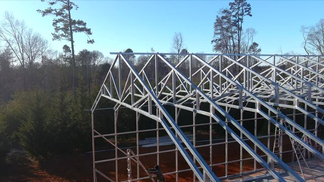 Metallic structure is taking shape as construction progresses in metal framed warehouse