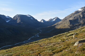 Hiking through beautiful landscapes to Galdhøpiggen in the Jotunheimen Mountain Range in Norway