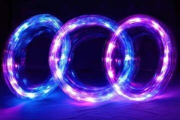 luminous streaks of electric blue and violet light trails creating a dynamic vortex pattern against dark background, suggesting high-speed motion and energy