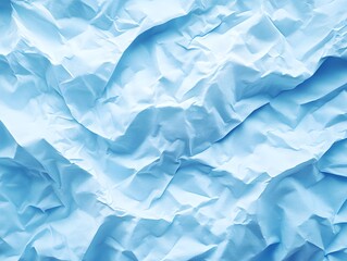 Obraz premium Textured Light Blue Crumpled Paper: Abstract background of crumpled light blue paper, creating a textured and dynamic surface with varying shades and folds.