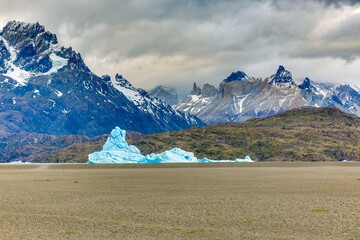 View from the far end of Lago Grey with icebergs and dramatic mountain backdrop in Torres del Paine