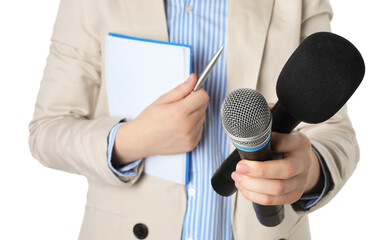 Journalist with microphones, notebook and pen on white background, closeup