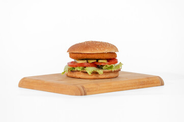 Hamburger on a wooden board on a white background, isolate