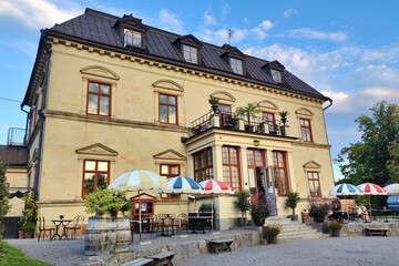 Fototapeta premium The exterior architecture and interior design of an old classic yellow castle in Scandinavia
