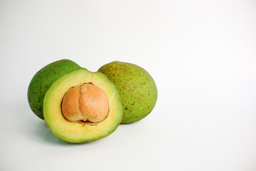 avocado (Persea americana), cut half of ripe avocado, avocado isolated on white background. avocado slices.