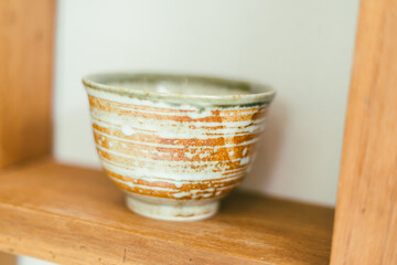 Close up handmade bowl ceramic on shelves