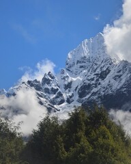 Hiking in the stunning Khumbu Valley surrounded by glaciars and snowy peaks in the Himalayan...