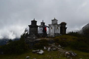 Hiking in the stunning Khumbu Valley surrounded by glaciars and snowy peaks in the Himalayan...