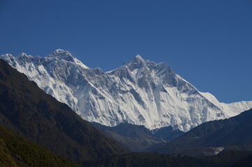 Hiking in the stunning Khumbu Valley surrounded by glaciars and snowy peaks in the Himalayan...
