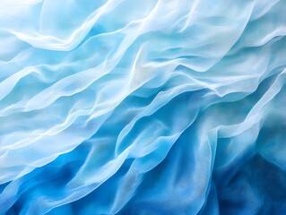 Obraz premium Aqua Silk Drape: Abstract image of flowing silk fabric in shades of blue and white, creating a soft, dreamy, and elegant texture. The gradient creates a calming and serene atmosphere.