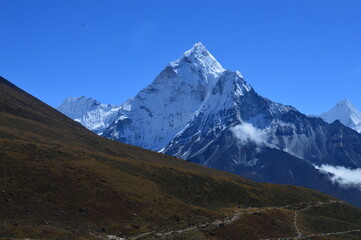 The stunning Himalayan Mountain ranges with snowy  glaciars and breathtaking views of Mount Everest, Ama Dablam and Lhotse while trekking