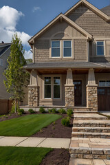 Dream Suburban Home: Captivating Exterior Design with Stone Facade and Lush Landscaping