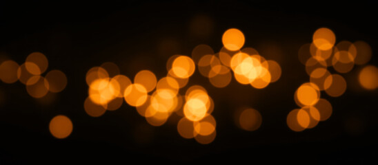 Soft glowing golden bokeh background with blurred circles of light, warm abstract defocused texture, dreamy festive shimmer, bright elegant illumination, radiant golden glow, artistic overlay