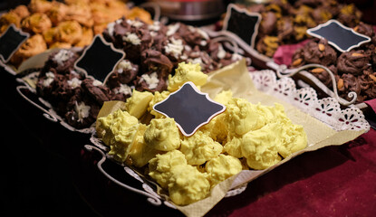 A tray of yellow and brown pastries sits on a table