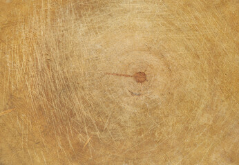 Old rustic kitchen chopping board close-up.
