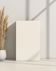 Elegant vertical book frame mockup with soft lighting and a modern minimalist interior
