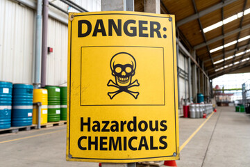 A warning sign indicating the presence of hazardous chemicals, featuring a skull and crossbones symbol for danger.