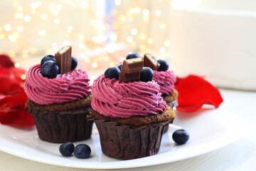 Tasty blueberry cupcakes with chocolate             