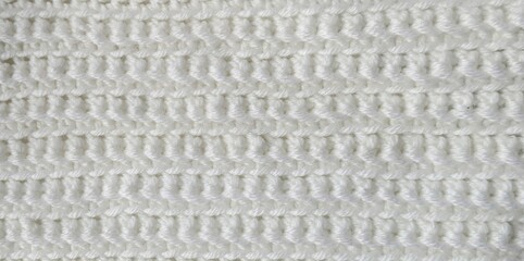 Crochet white wool cashmere background. Close up