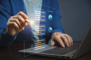 Document checklist online. A person is working on a laptop, interacting with virtual elements on the screen. The screen displays tasks and their statuses.