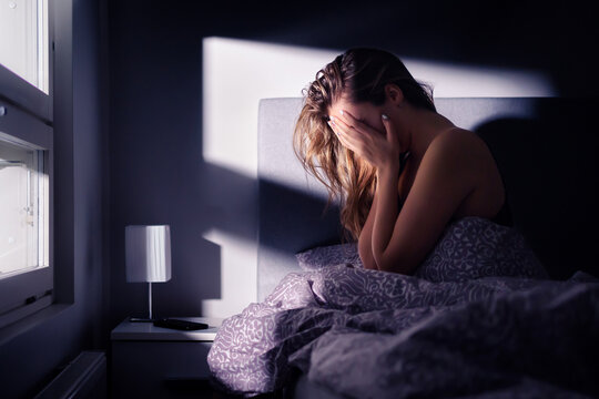 Nightmare or insomnia. Woman in bed. Anxiety and stress at night. Sleep apnea. Sad depressed with trauma or disorder. Sleepless crying. Schizophrenia, loneliness, panic or shame. Bad dream. Headache.