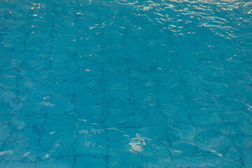 The Clear and Beautifully Glimmering Blue Water Surface Shimmers Radiantly in the Bright Sunlight