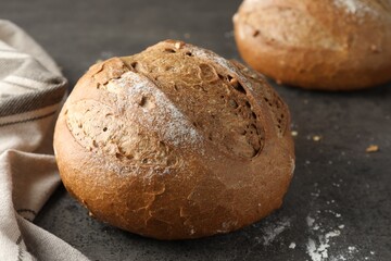 Freshly baked bread on grey table, closeup