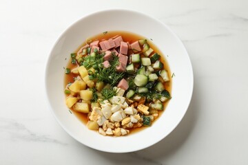 Delicious okroshka soup with kvass on white table, top view