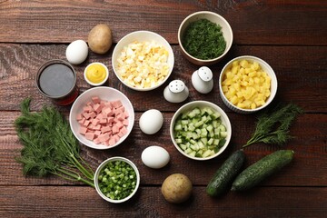 Different ingredients for okroshka soup on wooden table, flat lay