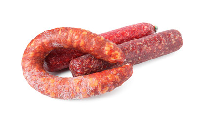 Many different smoked sausages isolated on white