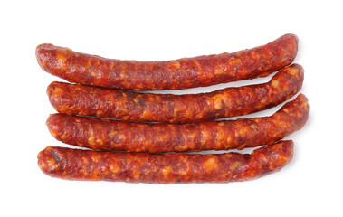 Many thin dry cured sausages isolated on white, top view