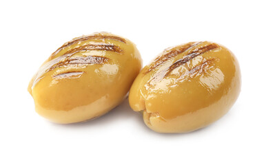 Two grilled green olives isolated on white