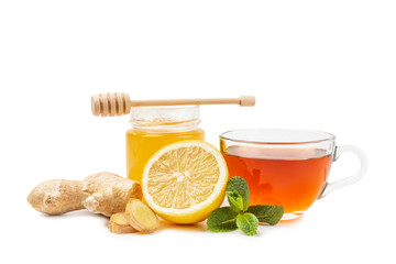 Cup of hot ginger tea with slices of ginger root isolated on white background. Warming drink....