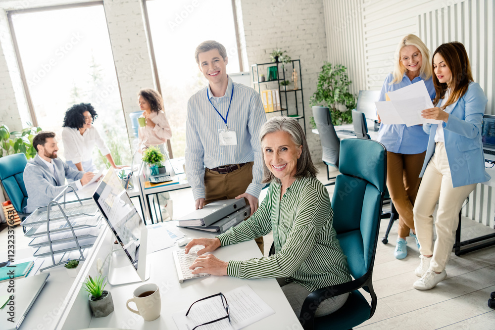 Poster professional office environment with diverse team working collaboratively in a modern workspace