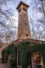 A tall tower with ivy growing on it